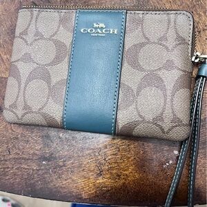- Coach Signature Canvas Wristlet with Green Leather Trim—